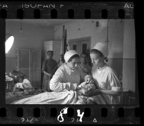 Nurses attending to a patient in the hospital