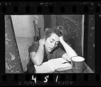 Portrait of Stefania Schoenberg, reading at a table