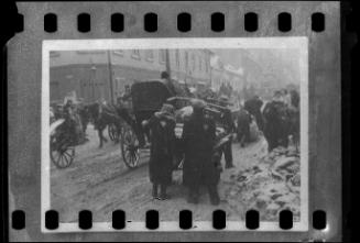 Residents transporting goods through the ghetto
