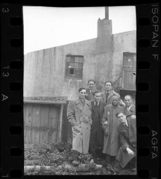Members of the ghetto administration standing outside a building in the ghetto
