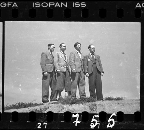 Four male ghetto residents posing