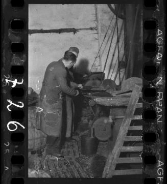 Two men working in a factory