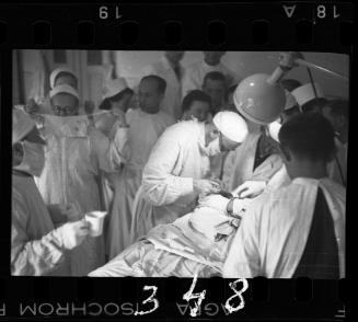 Doctors performing surgery on baby