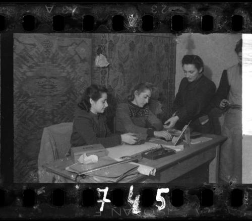 Stefania Schoenberg and three unidentified women working at a desk