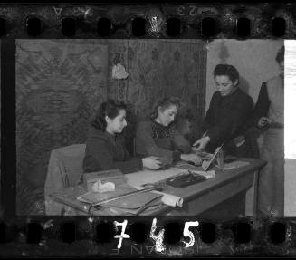 Stefania Schoenberg and three unidentified women working at a desk