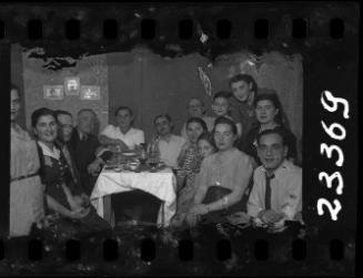 Residents gathered around the table at a dinner party