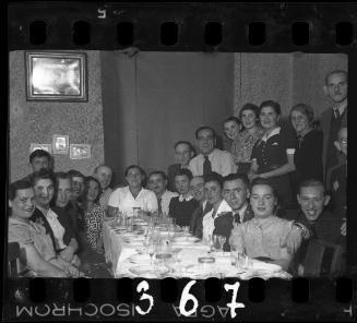 Residents gathered around the table at a dinner party
