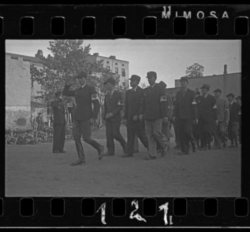 Jewish policemen marching through the ghetto