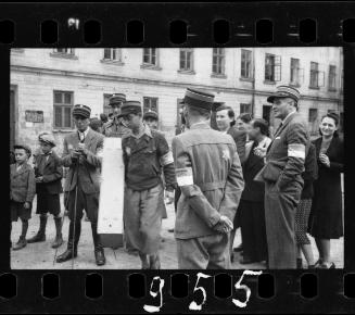 Postal workers and residents in the street