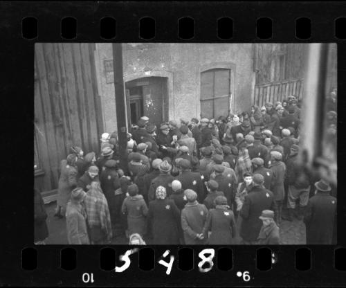 Residents gathered outside the doorway of building #44 in the ghetto