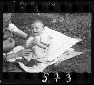 Baby on a blanket outside