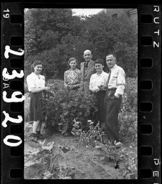 Two men with three young women