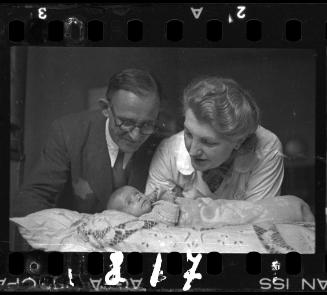 Mother and father with a baby