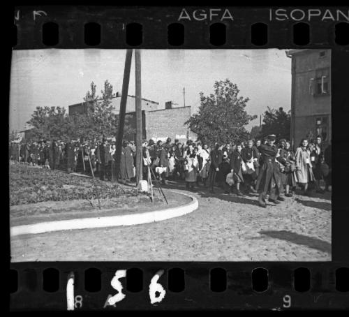 Mass deportation led by ghetto officials, approaching corner