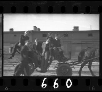 Group of residents posing in a carriage in the ghetto