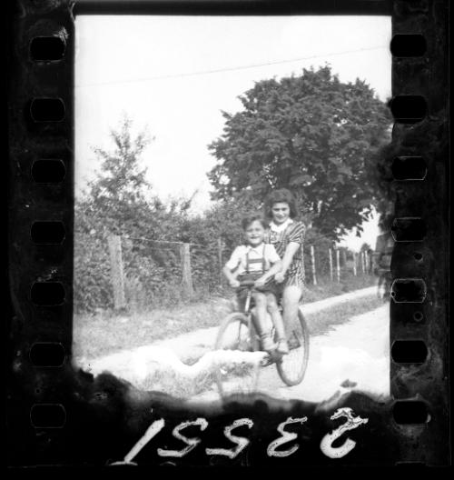 Girl and a boy riding a single bike