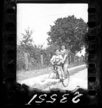 Girl and a boy riding a single bike