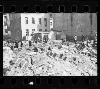 Residents standing in the synagogue on Wolborska Street, destroyed by the Germans in 1939
