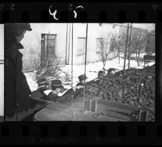 Policemen gathering coal