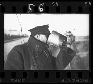 A Transport Department worker drinking from cup