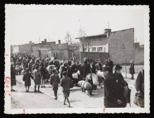 Group of residents walking in streets for deportation OR people moving into/out of Lodz Ghetto