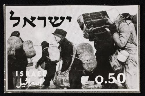 Boy in cap, with satchel and sack tied to back, walking with winter deportation crowd - side-profile