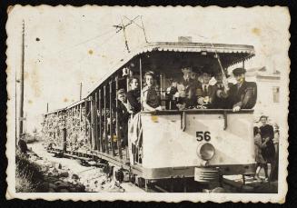 Tram #56 with residents and shipment of goods