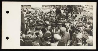 Chaim Rumkowski surrounded by large crowd of ghetto police and residents