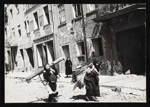 Two women carrying salvaged items, Lodz Ghetto