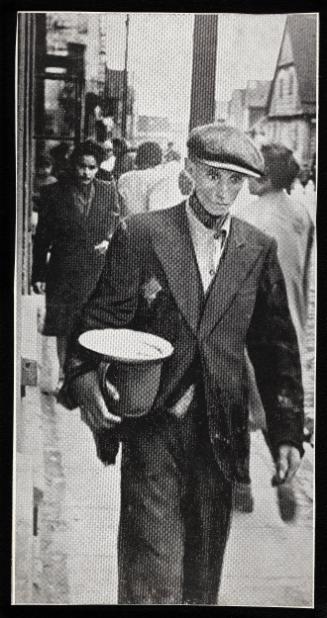 Hungry man walking on street with pail and empty plate