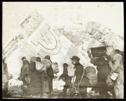 (In photomontage with synagogue in ruins) Boy in cap, with satchel and sack tied to back, walking with winter deportation crowd - side-profile
