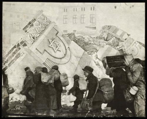 (In photomontage with synagogue in ruins) Boy in cap, with satchel and sack tied to back, walking with winter deportation crowd - side-profile