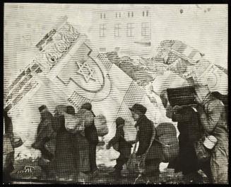 (In photomontage with synagogue in ruins) Boy in cap, with satchel and sack tied to back, walking with winter deportation crowd - side-profile