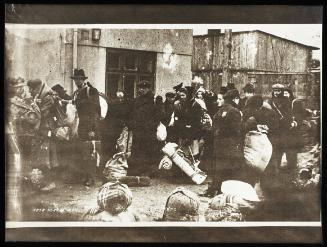 Deportation of residents with sacks and bedrolls