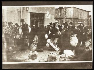 Deportation of residents with sacks and bedrolls