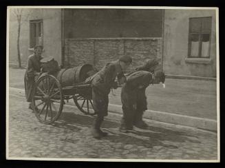 Workers pulling fecal wagon