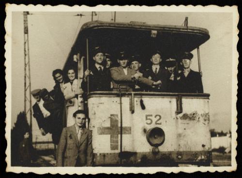 Workers of the Transport Department riding tram #52