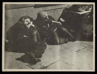 Two boys sleeping on street