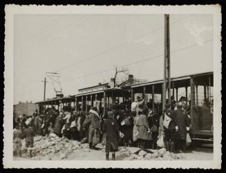 Boarding tram for deportation