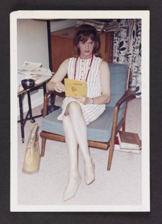 [Donna (Buff/Cynthia) looking at photographs, Casa Susanna, Hunter, NY]
