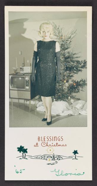 [Christmas card, Gloria in a black dress at home, Clarion, Michigan]
