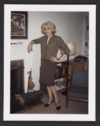 [Susanna standing by the fireplace, Casa Susanna, Hunter, NY]
