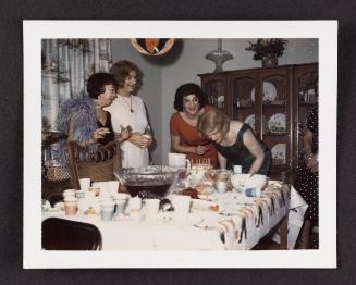 [Susanna and friends blowing out candles, location unknown]
