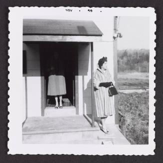 [Unnamed crossdresser by the doorway in a fur coat, Chevalier d’Éon, Hunter, NY]
