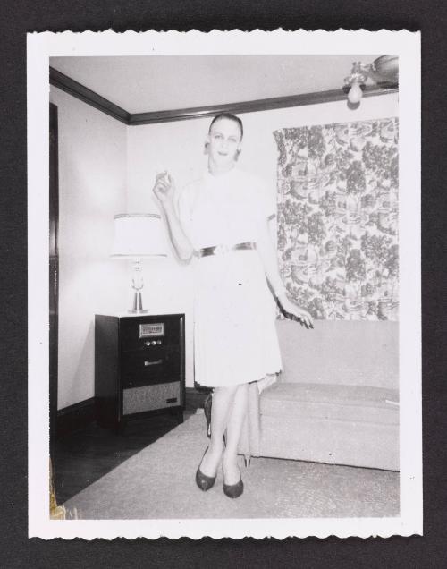 [Beverly without her wig, location unknown]
