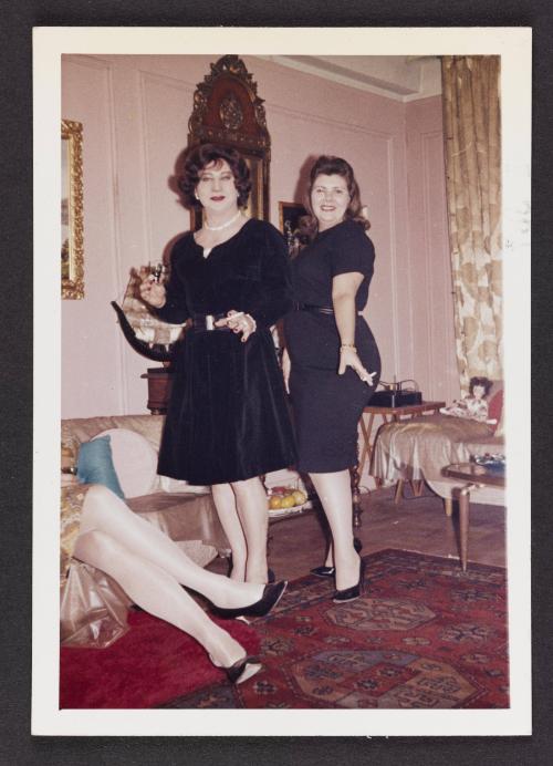 [Gail and friend in black dresses in Susanna and Marie’s New York City apartment]
