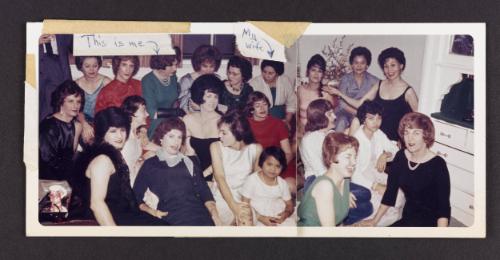 [Large group in the living room, location unknown]
