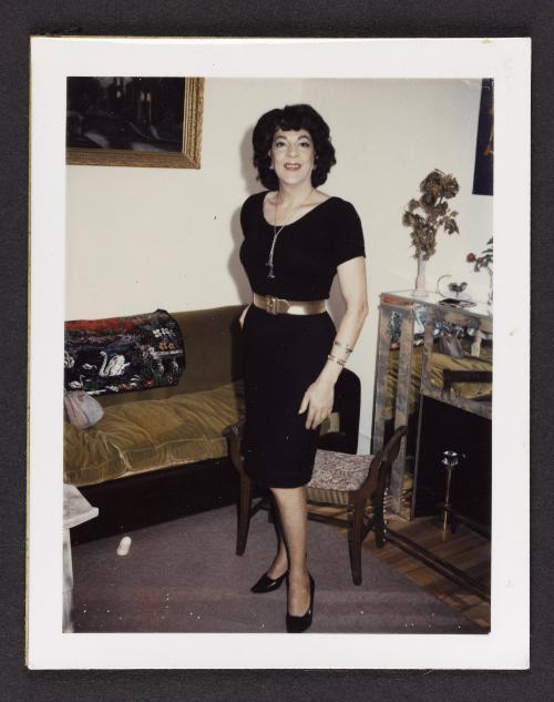 [Susanna in a black dress with a gold belt, Casa Susanna, Hunter NY]
