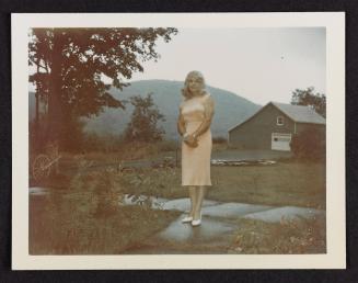 [Unnamed crossdresser in a peach dress and white shoes, Casa Susanna, Hunter, NY]
