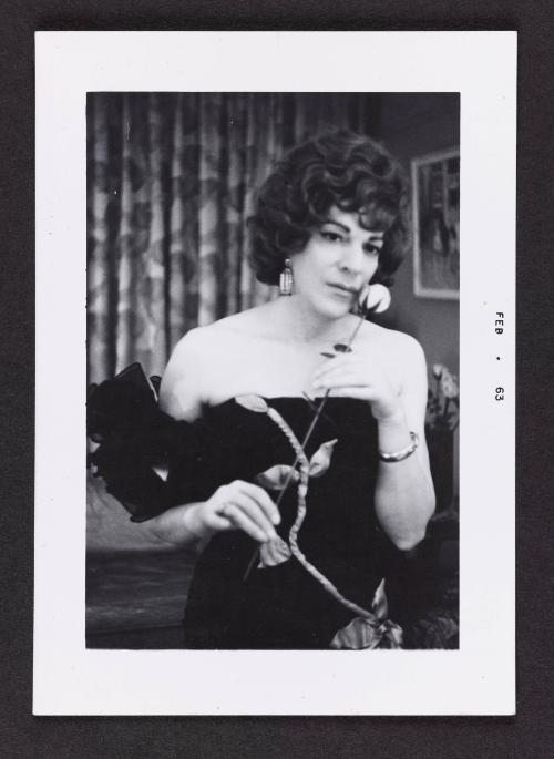 [Susanna holding a rose in her New York City apartment]
